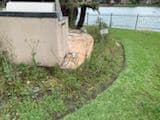 Stone fire pit with curved wall and patio